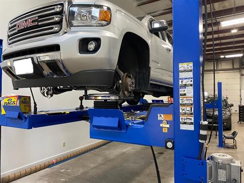 Broken Truck on lift at mechanic shop, Trumans Automotive & ADAS Calibrations