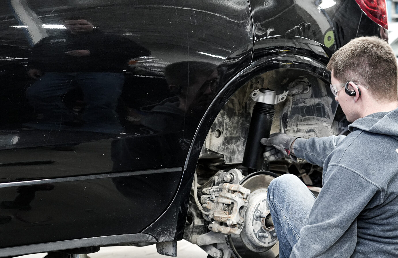 Guy fixing Brakes, Tires, Suspension, Repair